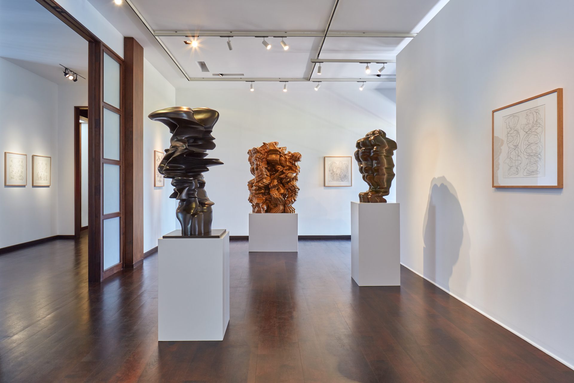 L-R: Level Head, Bronze, 2015; In No Time, Bronze, 2018; Woman's Head, Bronze, 2015