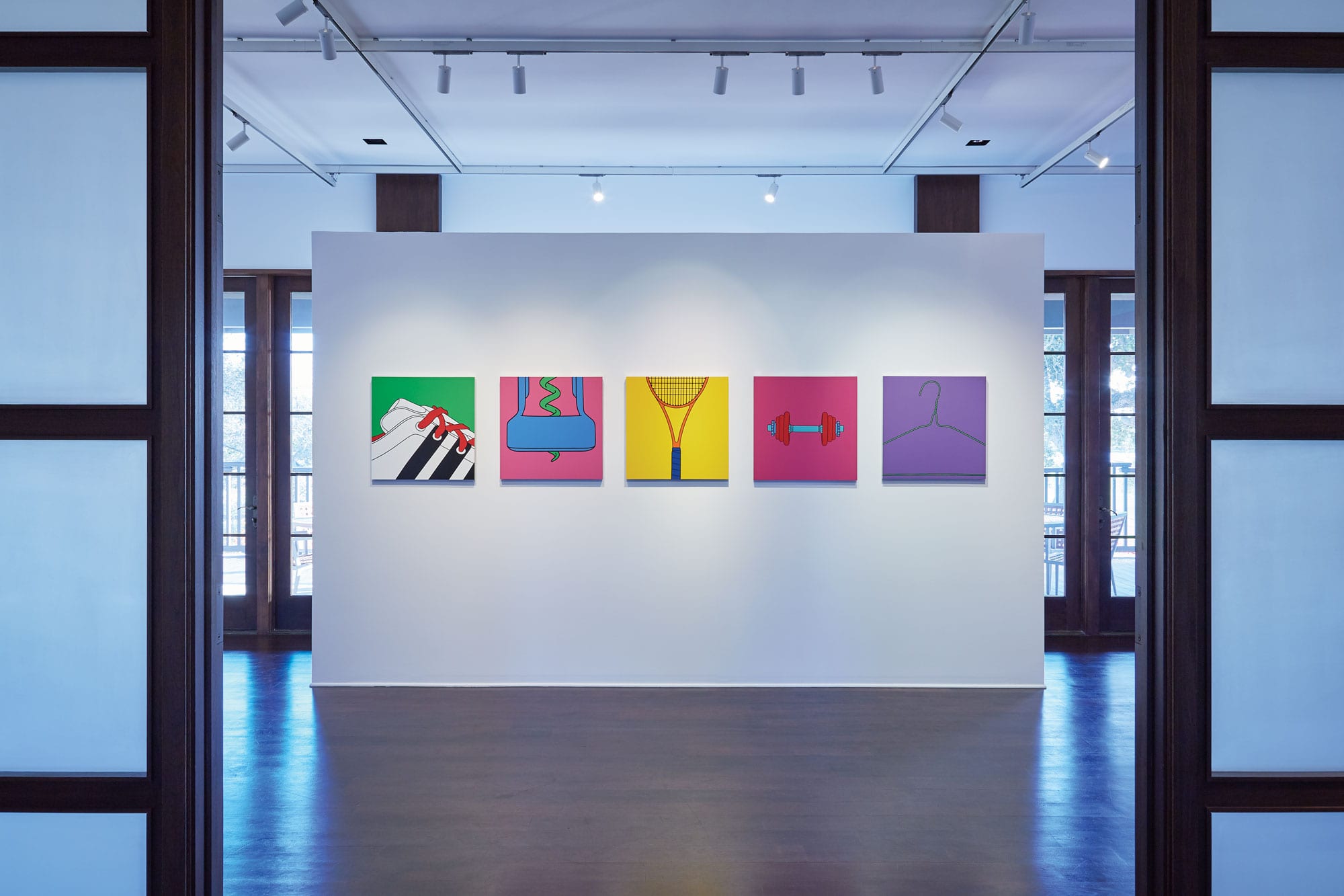 The West Hall at The Gallery at Windsor showing a series of paintings of everyday objects by Michael Craig-Martin.